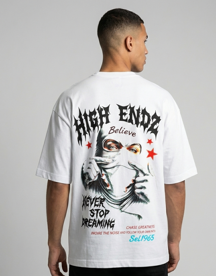 Person wearing a white t-shirt with graphic design and text on the back, standing against a gray background.