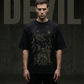 Person wearing a black t-shirt with graphic design against a dark background with 'DEVIL' text.