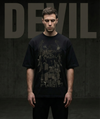 Person wearing a black t-shirt with graphic design against a dark background with 'DEVIL' text.